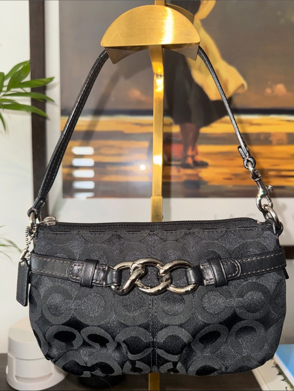 Coach Op Art Signature C black jacquard wristlet featuring silver hardware.